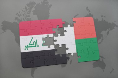 bir dünya haritası arka plan üzerinde Irak ve madagaskar ulusal bayrağı ile bulmaca.