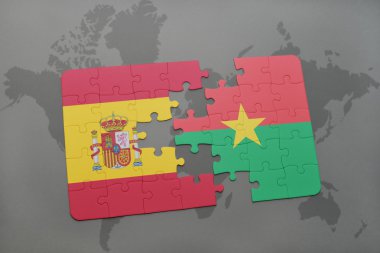 bir dünya haritası arka plan üzerinde İspanya ve burkina faso ulusal bayrağı ile bulmaca.
