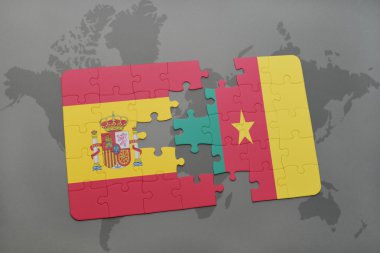 bir dünya haritası arka plan üzerinde İspanya ve Kamerun ulusal bayrağı ile bulmaca.