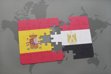 bir dünya haritası arka plan üzerinde İspanya ve Mısır ulusal bayrağı ile bulmaca.