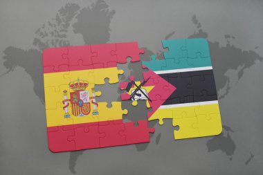 bir dünya haritası arka plan üzerinde İspanya ve mozambik ulusal bayrağı ile bulmaca.
