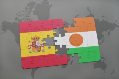 bir dünya haritası arka plan üzerinde İspanya ve nijer ulusal bayrağı ile bulmaca.