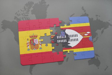 İspanya ve Svaziland dünya harita arka plan üzerinde bayrağı ile bulmaca.