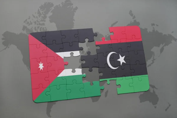 세계지도 배경에 요르단과 리비아의 국기퍼즐. — 스톡 사진