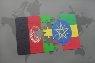 bir dünya haritası arka plan üzerinde Afganistan ve Etiyopya ulusal bayrağı ile bulmaca.