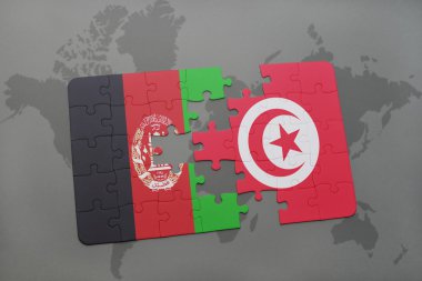 bir dünya haritası arka plan üzerinde Afganistan ve Tunus ulusal bayrağı ile bulmaca.