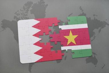 bir dünya haritası arka plan üzerinde bahreyn ve surinam ulusal bayrağı ile bulmaca.