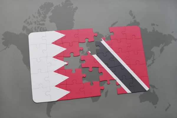 Pussel med den nationella flaggan i Bahrain och Trinidad och Tobago på en världskarta bakgrund. — Stockfoto