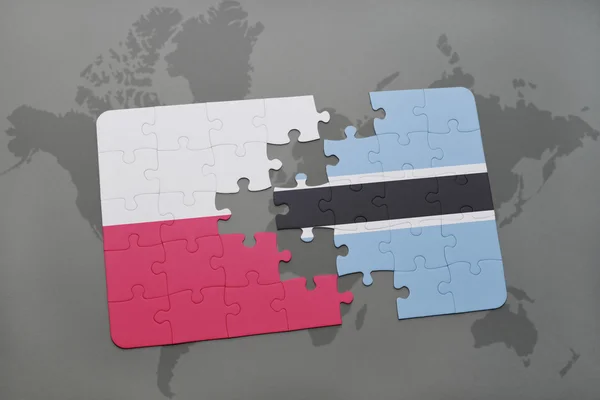 Puzzle with the national flag of poland and botswana on a world map background. 3D illustration — Stock Photo, Image