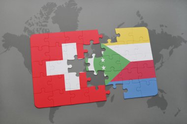 bir dünya haritası arka plan üzerinde İsviçre ve komor ulusal bayrağı ile bulmaca.