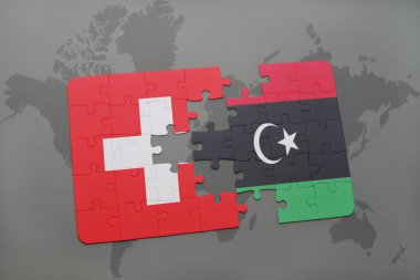 bir dünya haritası arka plan üzerinde İsviçre ve Libya ulusal bayrağı ile bulmaca.