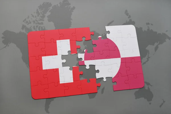 Головоломка з національним прапором Швейцарії та Гренландії на карті світу. — стокове фото