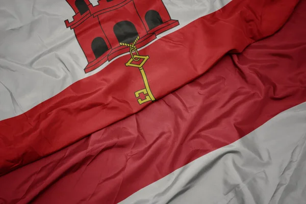 Színes Indonéziai Zászlót Lobogtatva Gibraltári Nemzeti Zászlót Lobogtatva Makroszintű — Stock Fotó