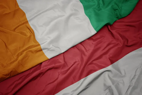 Schwenken Bunte Flagge Von Indonesien Und Nationalflagge Von Cote Divoire — Stockfoto