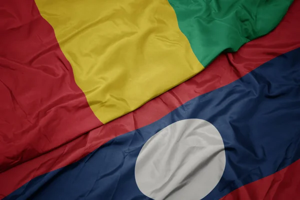 Zwaaiende Vlag Van Laos Nationale Vlag Van Guinea Macro — Stockfoto