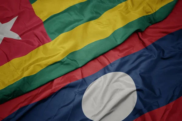 Acenando Bandeira Colorida Laos Bandeira Nacional Togo Macro — Fotografia de Stock