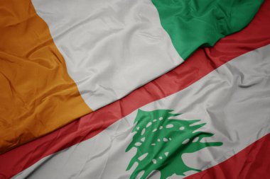 Lübnan 'ın renkli bayrağı ve Cote Divoire' ın ulusal bayrağı sallanıyor. makro