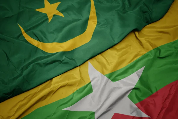 Schwenken Bunte Flagge Von Myanmar Und Nationalflagge Von Mauretanien Makro — Stockfoto