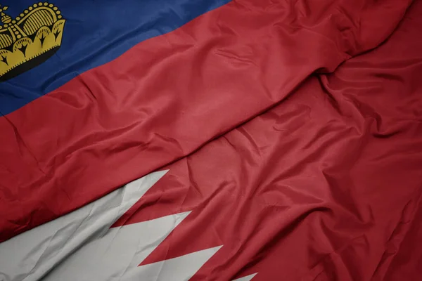 Schwenken Bunte Fahne Des Bahrains Und Nationalflagge Von Liechtenstein Makro — Stockfoto