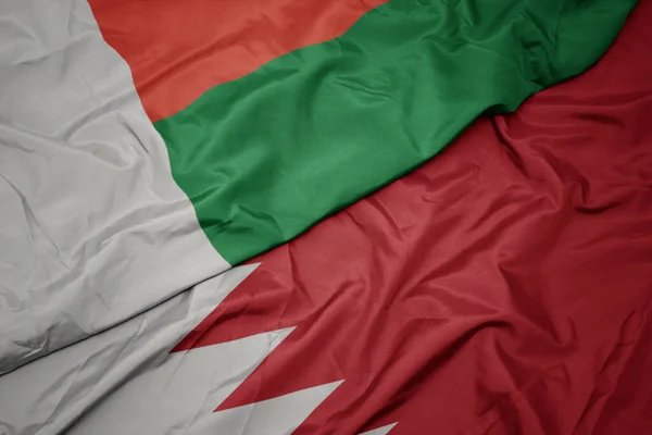 Waving Colorful Flag Bahrain National Flag Madagascar Macro — Stock Photo, Image