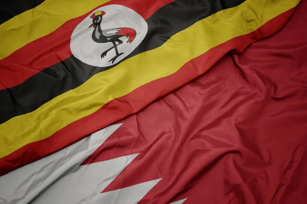 Acenando Com Bandeira Colorida Bahrein Bandeira Nacional Uganda Macro — Fotografia de Stock