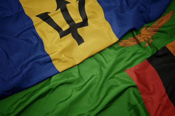 Machając Barwną Flagą Zambii Narodową Flagą Barbadosu Makro — Zdjęcie stockowe