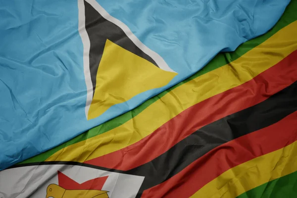 Размахивая Красочным Флагом Зимбабве Национальным Флагом Святой Люсии Macro — стоковое фото