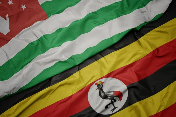 Размахивая Красочным Флагом Уганды Национальным Флагом Абхазии Macro — стоковое фото