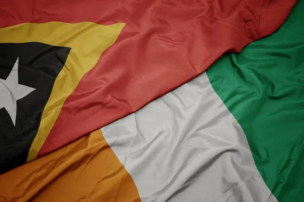 Sventolando Bandiera Colorata Cote Divoire Bandiera Nazionale Timor Est Macro — Foto Stock