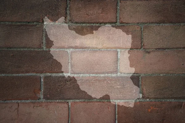 painted map of iran on a old brick wall