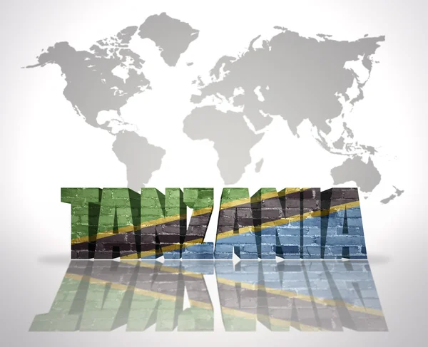 Slovo Tanzanie na pozadí mapy světa — Stock fotografie