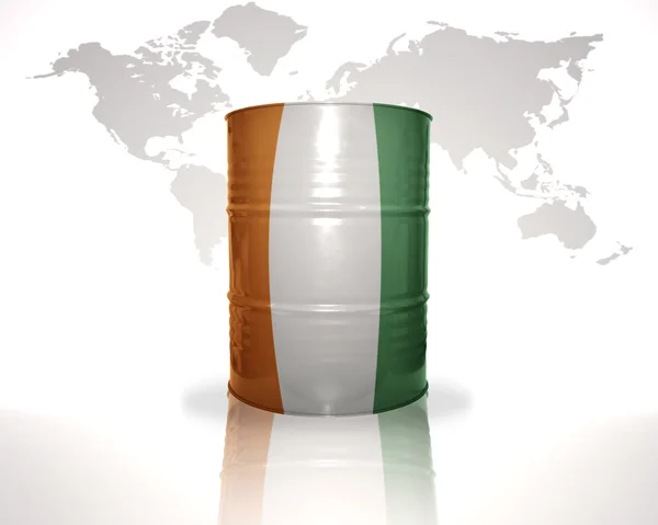 Barrel with cote divoire flag on the world map background — Stock Photo, Image