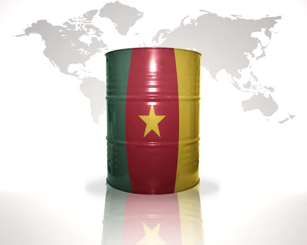 Barrel with cameroon flag on the world map background — Stock Photo, Image
