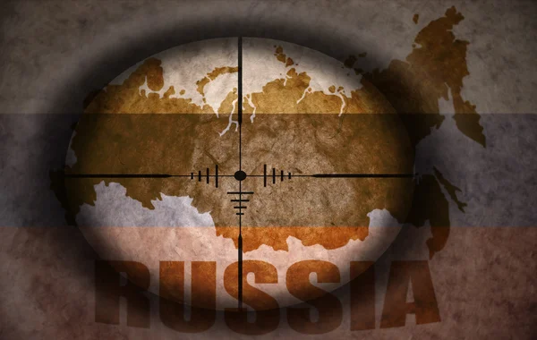 Sniper scope aimed at the vintage russian flag and map — Stock Photo, Image
