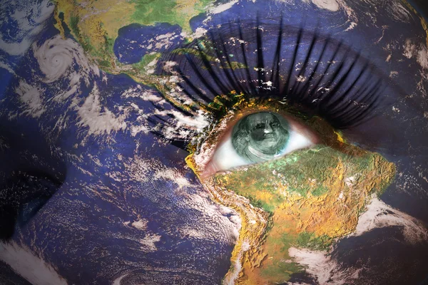 Woman's face with planet Earth texture and american banknote inside the eye — Stock Photo, Image