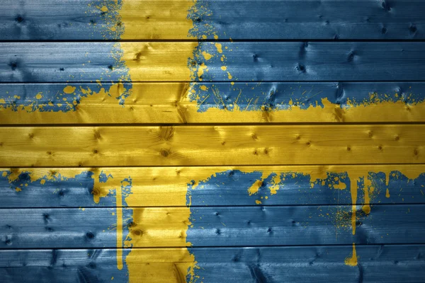 Painted swedish flag on a wooden texture — Stock Photo, Image