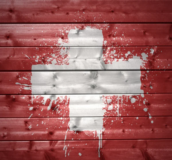 Bandera suiza pintada sobre una textura de madera —  Fotos de Stock