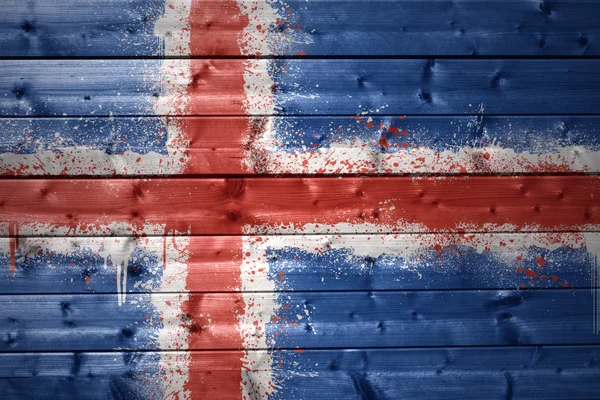 Målade isländsk flagga på en trä textur — Stockfoto