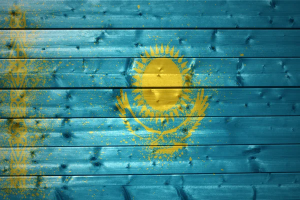 Målade Kazakstan flagga på en trä textur — Stockfoto