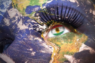 womans face with planet Earth texture and kurdistan flag inside the eye