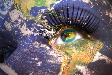 womans face with planet Earth texture and bahamas flag inside the eye