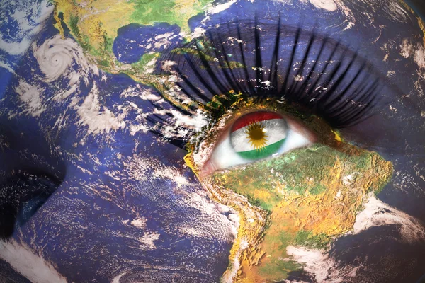 Womans face with planet Earth texture and kurdistan flag inside the eye — Stock Photo, Image