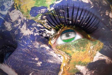womans face with planet Earth texture and uzbekistan flag inside the eye.