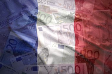 colorful waving french flag on a euro money background