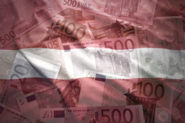 colorful waving latvian flag on a euro money background