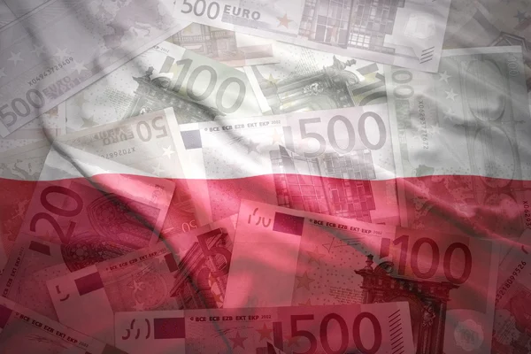 Colorful waving polish flag on a euro money background — Stockfoto