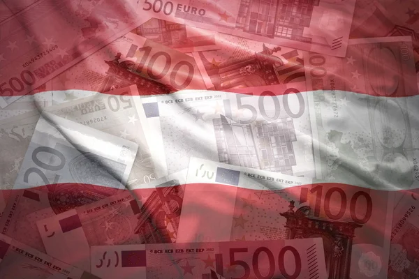 Colorful waving austrian flag on a euro money background — Stock Photo, Image