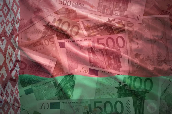 Colorful waving belarus flag on a euro money background — Stockfoto