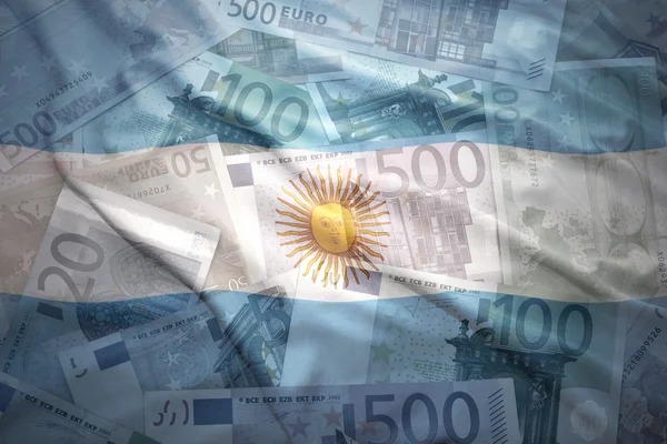 Colorful waving argentinean flag on a euro money background — Stock Photo, Image