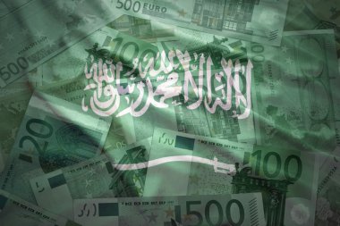 colorful waving saudi arabia flag on a euro money background